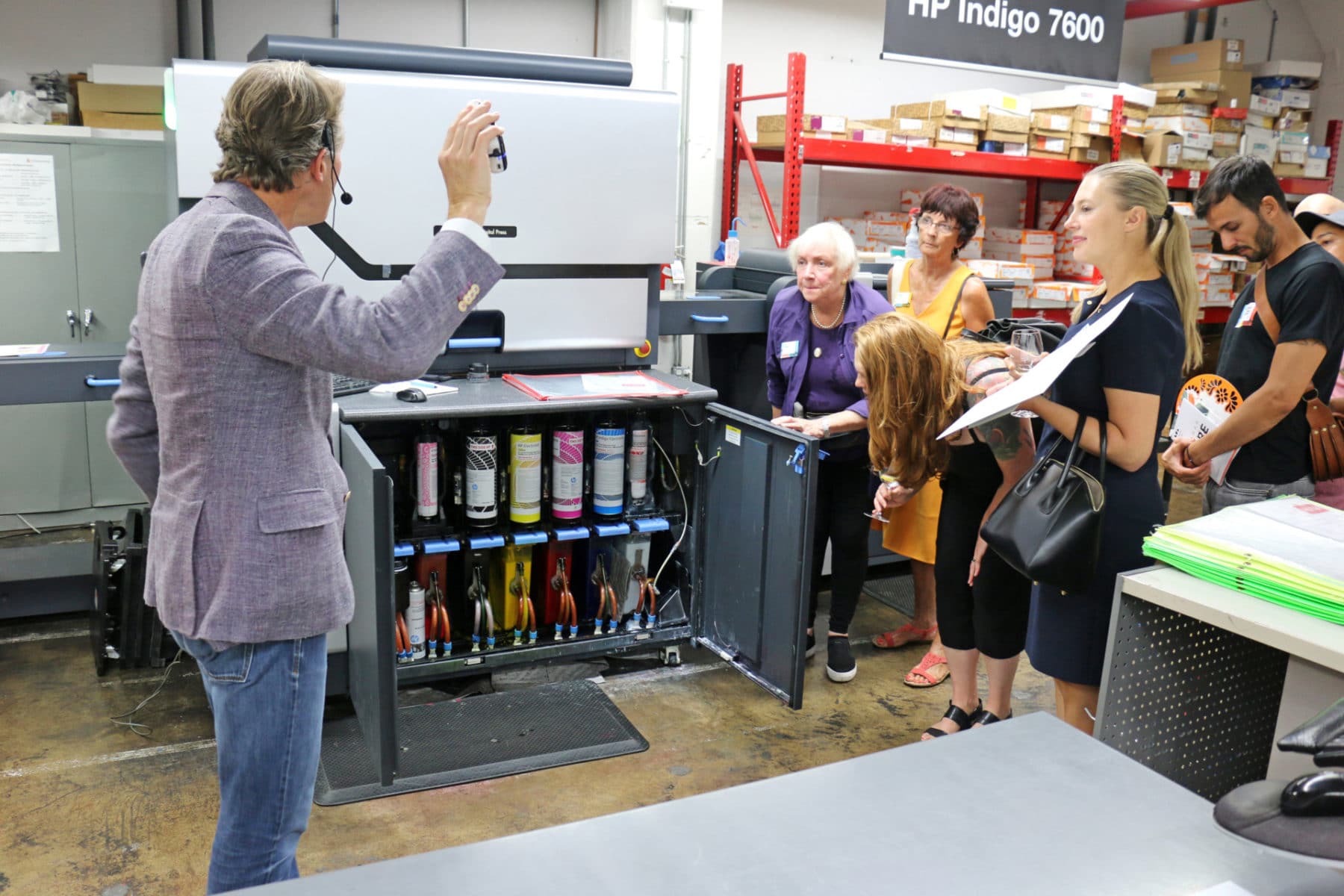 Guests observing Indigo printer during tour